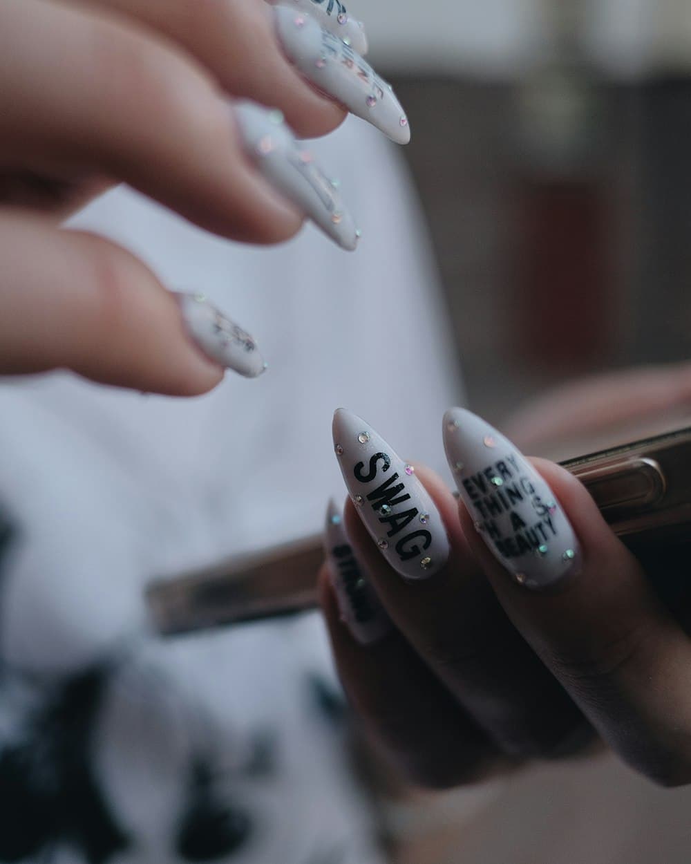 Hand-Painted Nail Art — custom lettering and rhinestone detail